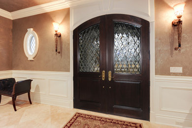Double front door - double front door idea in Chicago with a brown front door