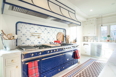 Eat-in kitchen - large traditional u-shaped ceramic tile and brown floor eat-in kitchen idea in New York with an undermount sink, flat-panel cabinets, white cabinets, quartzite countertops, white backsplash, porcelain backsplash, colored appliances, two islands and white countertops