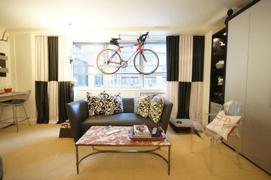 Living room - small contemporary open concept carpeted living room idea in New York with beige walls, no fireplace and no tv