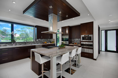 Open concept kitchen - contemporary u-shaped porcelain tile open concept kitchen idea in Miami with an island, flat-panel cabinets, dark wood cabinets, multicolored backsplash, stainless steel appliances and an undermount sink