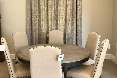 Inspiration for a rustic dining room in Devon with beige walls and carpet.