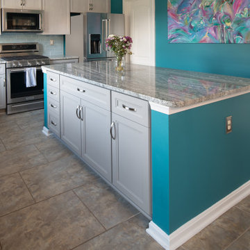 Gray Transitional Kitchen Cabinets with Complementary Gray Granite Countertops