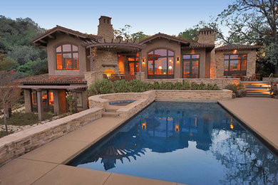 Inspiration for a huge mediterranean beige two-story stone exterior home remodel in San Francisco