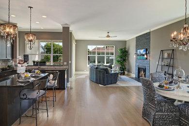 Open concept kitchen - mid-sized transitional u-shaped light wood floor and beige floor open concept kitchen idea in Chicago with an undermount sink, recessed-panel cabinets, dark wood cabinets, granite countertops, beige backsplash, matchstick tile backsplash, stainless steel appliances and an island