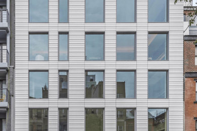 Example of a large trendy apartment exterior design in New York
