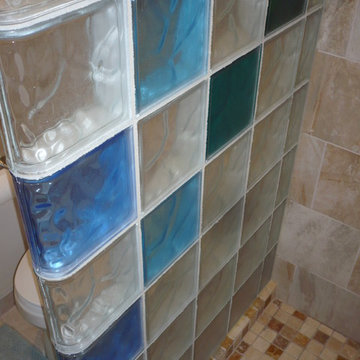 Los Alamos glass block shower with colored blocks and mosaic tile floor