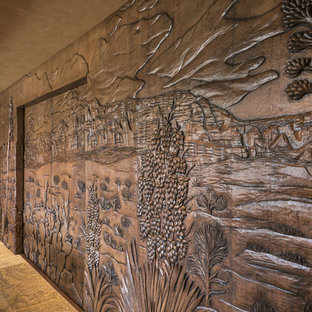 Expansive contemporary home cinema with beige walls and travertine flooring.