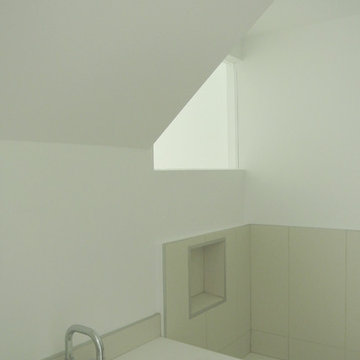 bathroom borrows light from the stairway