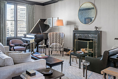 Inspiration for a transitional enclosed carpeted living room remodel in Philadelphia with a music area, gray walls, a standard fireplace, a stone fireplace and no tv