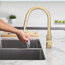 Modern Single Handle Pull down Sprayer Kitchen Faucet in Gold Finish