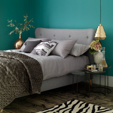 A vibrant turquoise bedroom with animal prints
