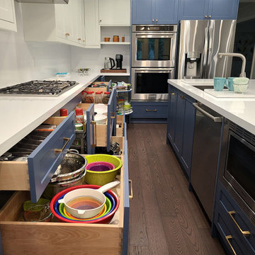 Two tone white and blue kitchen design.