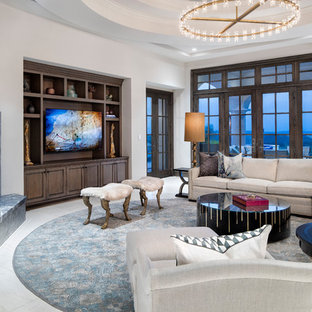Medium sized mediterranean open plan living room in Austin with white walls, a stone fireplace surround, a built-in media unit, white floors, marble flooring and a corner fireplace.