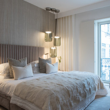 Avenida da Liberdade bedroom with upholstered headboard and pendants