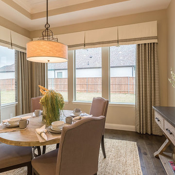 Dining room has ample sunlight thanks to four vinyl windows
