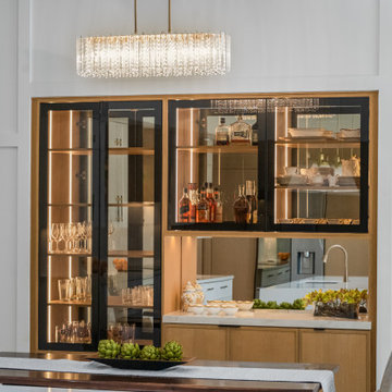Dining Area with Crystal Chandelier and Glass Display Cabinet
