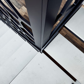 Stufen in Betonoptik und Voronoi Geländer in einem stylischen Büro