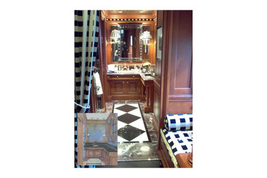 Example of a small classic master white tile and marble tile marble floor and red floor alcove shower design in New York with raised-panel cabinets, medium tone wood cabinets, a one-piece toilet, an undermount sink, marble countertops and a hinged shower door