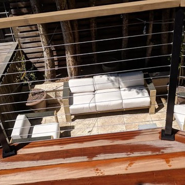 Split Level Travertine Patio and Ipe Deck with Cable Railing