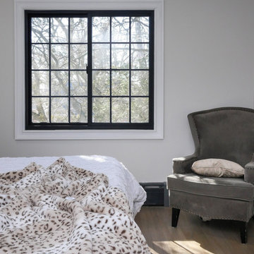 Trendy Bedroom with New Black Window - Renewal by Andersen Queens