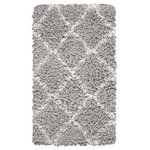 Nourison - Nourison Luxe Shag 2'2" x 3'9" Grey/Ivory Shag Indoor Area Rug - This exceptionally plush 2-inch-deep shag rug from the Nourison Luxe Shag Collection has the look and feel of luxuriously soft sheepskin, and makes a perfect addition to any casual room setting. Luxurious texture and Moroccan lattice pattern on pale grey color for a warm, soothing accent.