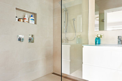 Photo of a mid-sized bathroom in Melbourne with an alcove shower, beige walls, dark hardwood floors and a drop-in sink.
