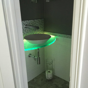 Illuminated glass countertop for a 1/2 bath