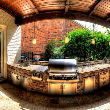 Grand home addition with outdoor kitchen see through fireplace - km