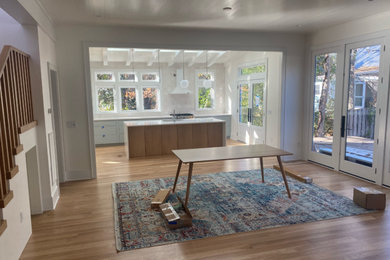 Kitchen - large scandinavian light wood floor kitchen idea in Other with recessed-panel cabinets, gray cabinets, quartz countertops, white backsplash, an island and white countertops