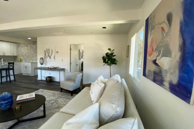 Living room - small transitional open concept gray floor living room idea in Los Angeles with white walls
