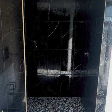 black marble tile shower