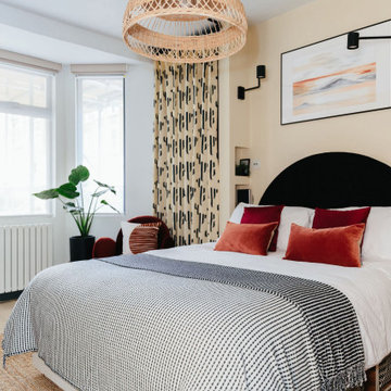 Modern Warm Neutral Bedroom with Pops of Burnt Red