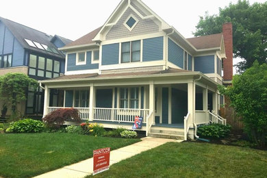 Ornate blue two-story house exterior photo in Indianapolis