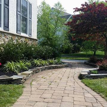 Flagstone wall around planting beds and installation of new plant material