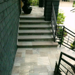 Inspiration for an u-shaped metal railing staircase in Seattle with slate treads and slate risers.