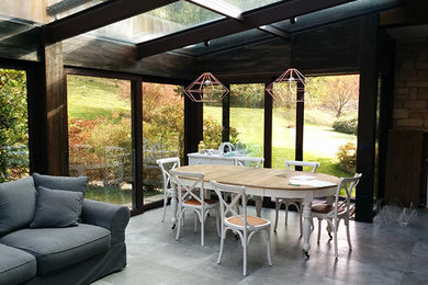 Photo of a contemporary sunroom in Milan.
