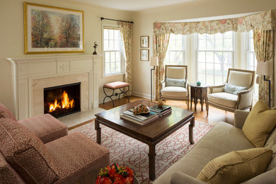 Example of a classic formal medium tone wood floor living room design in Minneapolis with beige walls, a standard fireplace and a tile fireplace