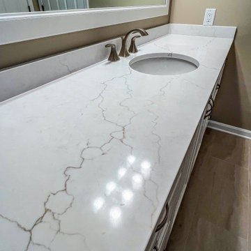 Timeless White Vanity Paired with Luxury Tiled Shower