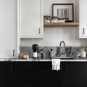 Tall White Cabinetry and Clever Storage Solutions for a Stylish Laundry Room Mak