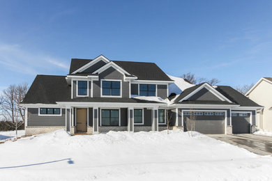 Example of a large farmhouse exterior home design in Other
