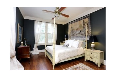 Bedroom - contemporary medium tone wood floor bedroom idea in Houston