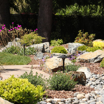 FRONT YARD WITH TREES AND DRY-CREEK