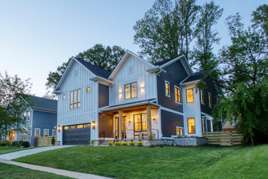 Craftsman multicolored three-story concrete fiberboard and board and batten house exterior idea in DC Metro with a shingle roof and a black roof