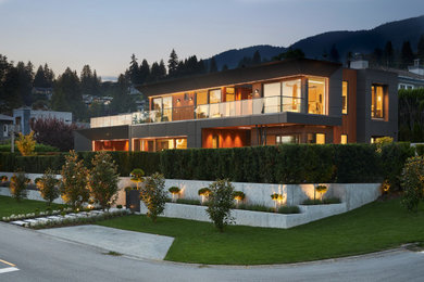 Inspiration for a contemporary three-story metal exterior home remodel in Vancouver