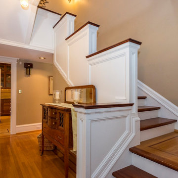 Extensive woodwork throughout includes unique stairway