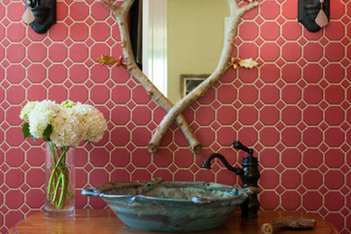 Traditional powder room in Other with a vessel sink and pink tile.