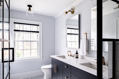 This is an example of a mid-sized modern master bathroom in Newark with flat-panel cabinets, black cabinets, an alcove shower, a two-piece toilet, white tile, marble floors, an undermount sink, engineered quartz benchtops, white floor, a hinged shower door, white benchtops, a niche, a double vanity and a built-in vanity.