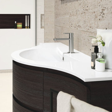 Modern bathroom with curved vanity
