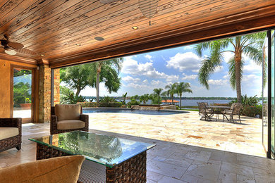 Patio - tropical patio idea in Houston