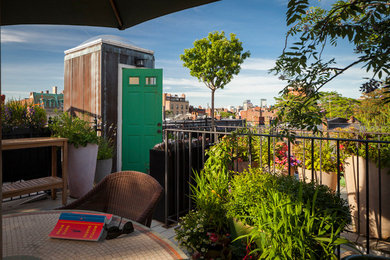 Inspiration for a mid-sized eclectic rooftop deck in Boston with no cover.